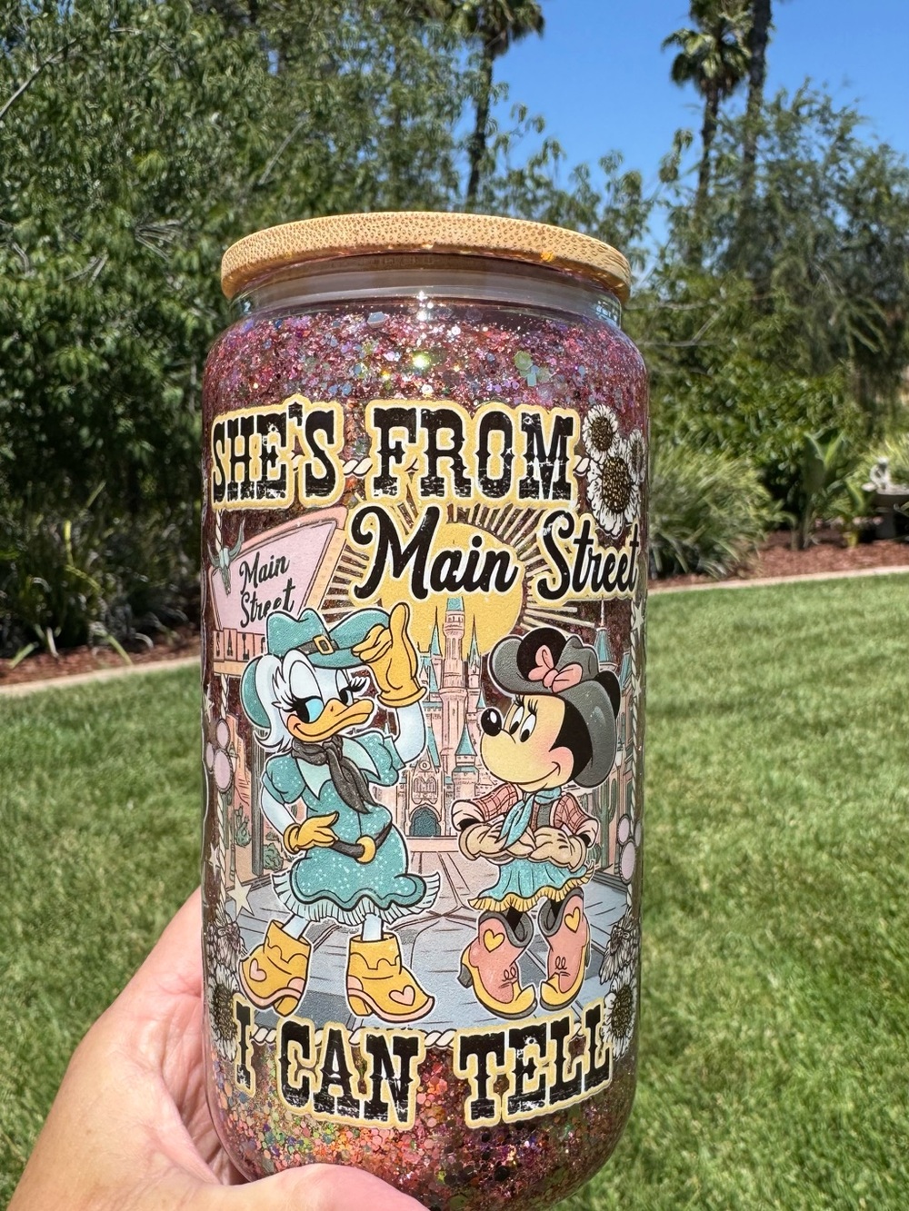 Minnie and Daisy she’s from Main Street I can tell snow globe tumbler